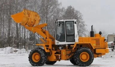 Фото Фронтальный погрузчик вездеход. Погрузка снега.