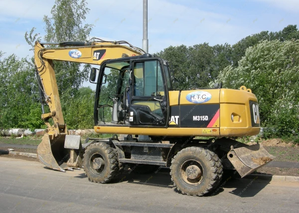 Фото Аренда колесного экскаватора Caterpillar M315D, Москва