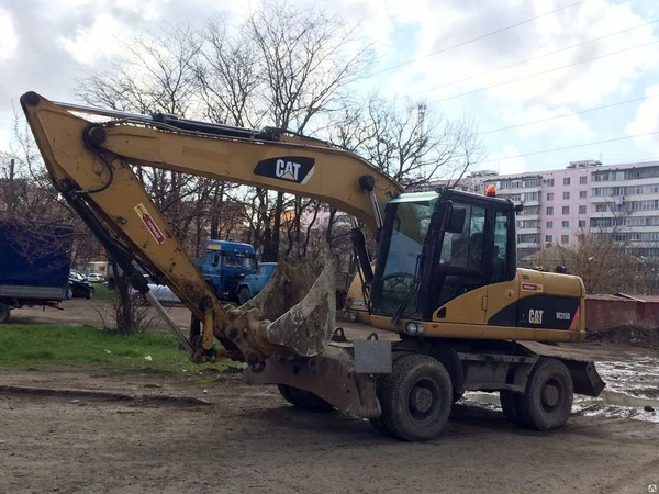 Фото Услуги колесного кубового экскаватора Caterpillar