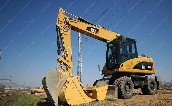 Фото Аренда колесного экскаватора Caterpillar M315D, Мытищи