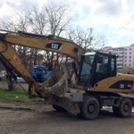 фото Услуги колесного кубового экскаватора Caterpillar