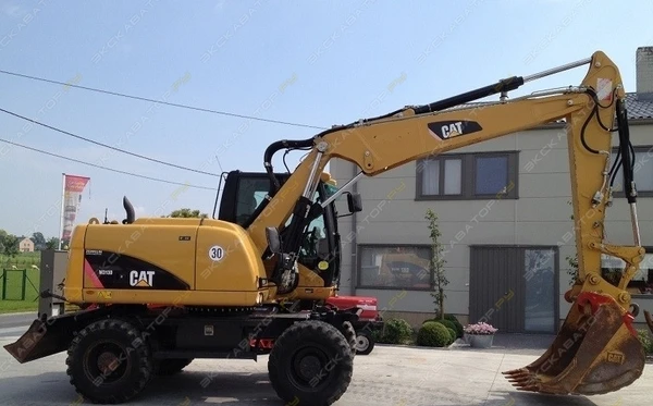 Фото Аренда колесного экскаватора Caterpillar M313D, Домодедово