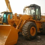 фото Фронтальный погрузчик мтз амкадор китайский jcb terex holland caterpillar