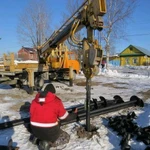 фото Бурение под скважины для винтовых свай