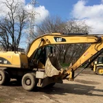 фото Аренда колесного кубового экскаватора Caterpillar