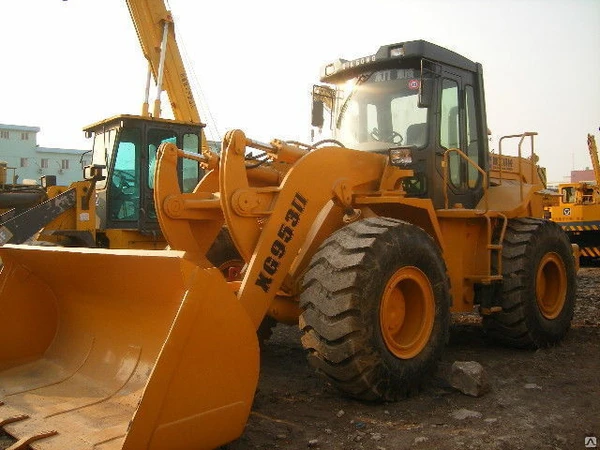 Фото Фронтальный погрузчик мтз амкадор китайский jcb terex holland caterpillar