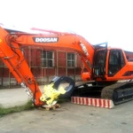 фото Перегружатель леса Doosan dx225 с лесозахватом