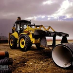 фото Экскаватор погрузчик New Holland B115B.