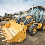 фото Экскаватор погрузчик John Deere 325 Экскаватор-погрузчик